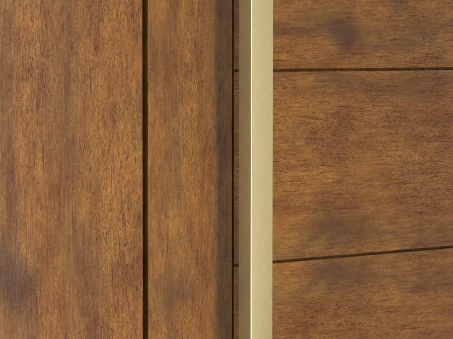 Vertical brushed satin brass square door pull with right angle return legs standing off a medium brown stained wood door.