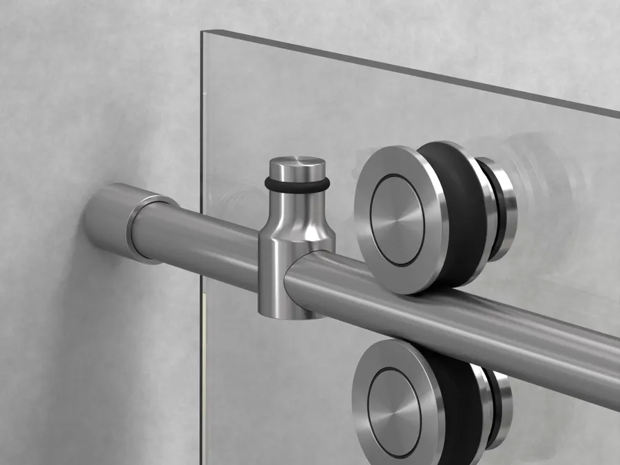 Close render of a double wheel shower roller in brushed satin, clamped to a glass panel against a concrete wall.